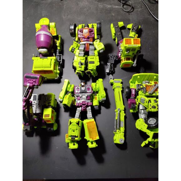 Lot Of NBK1 Transformers Various Figures Devastator Mixmaster Green/Purple